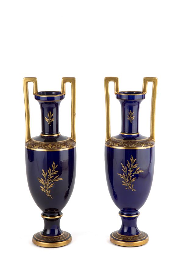 Pair of blue and gold vases. JAGET & PINON
