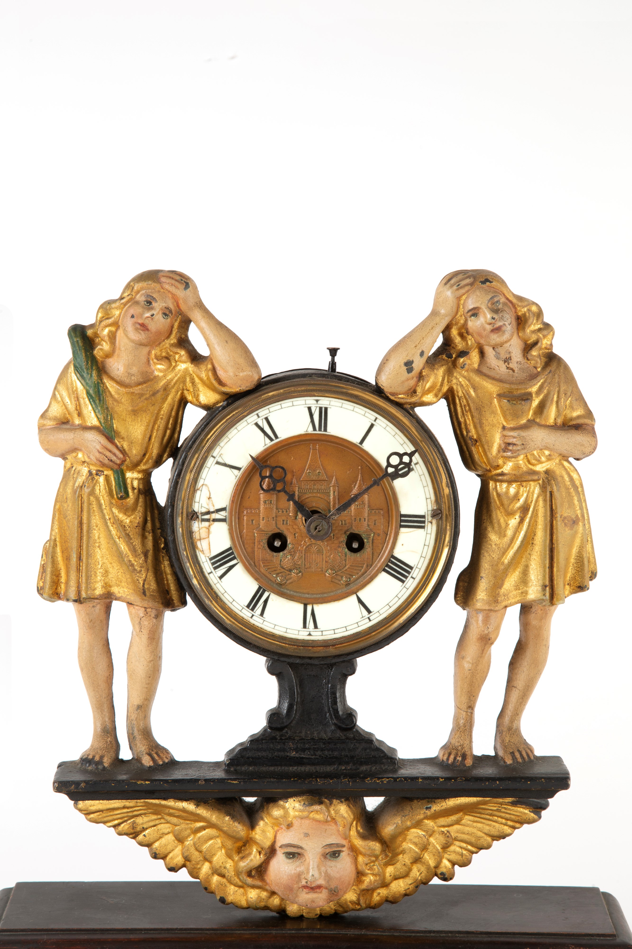 Orologio in ghisa dipinta, figure laterali (fine  XIX–inizi XX secolo)