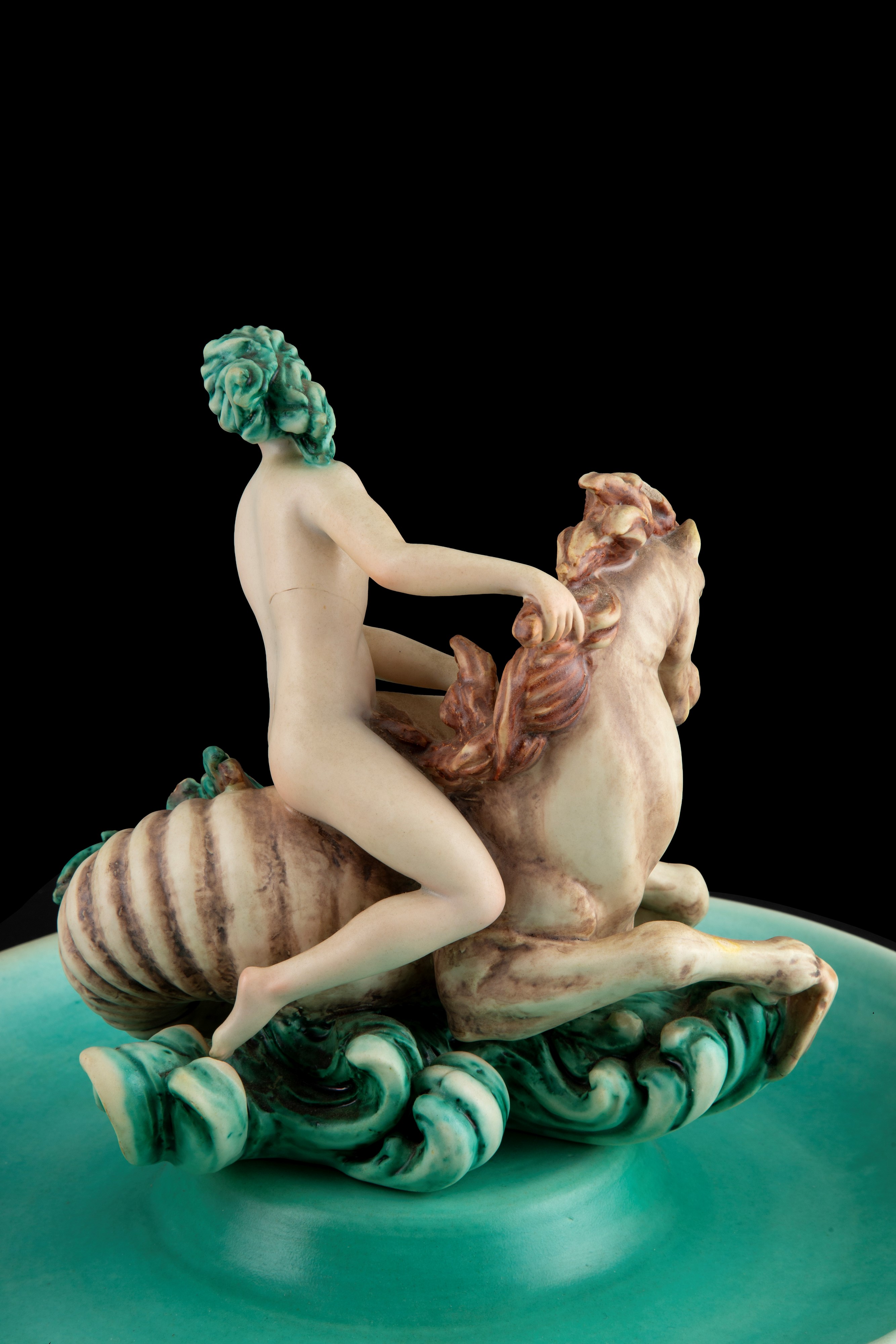 Nove di Bassano, Centrotavola con scultura raffigurante “Donna nuda a cavallo” in ceramica dipint...