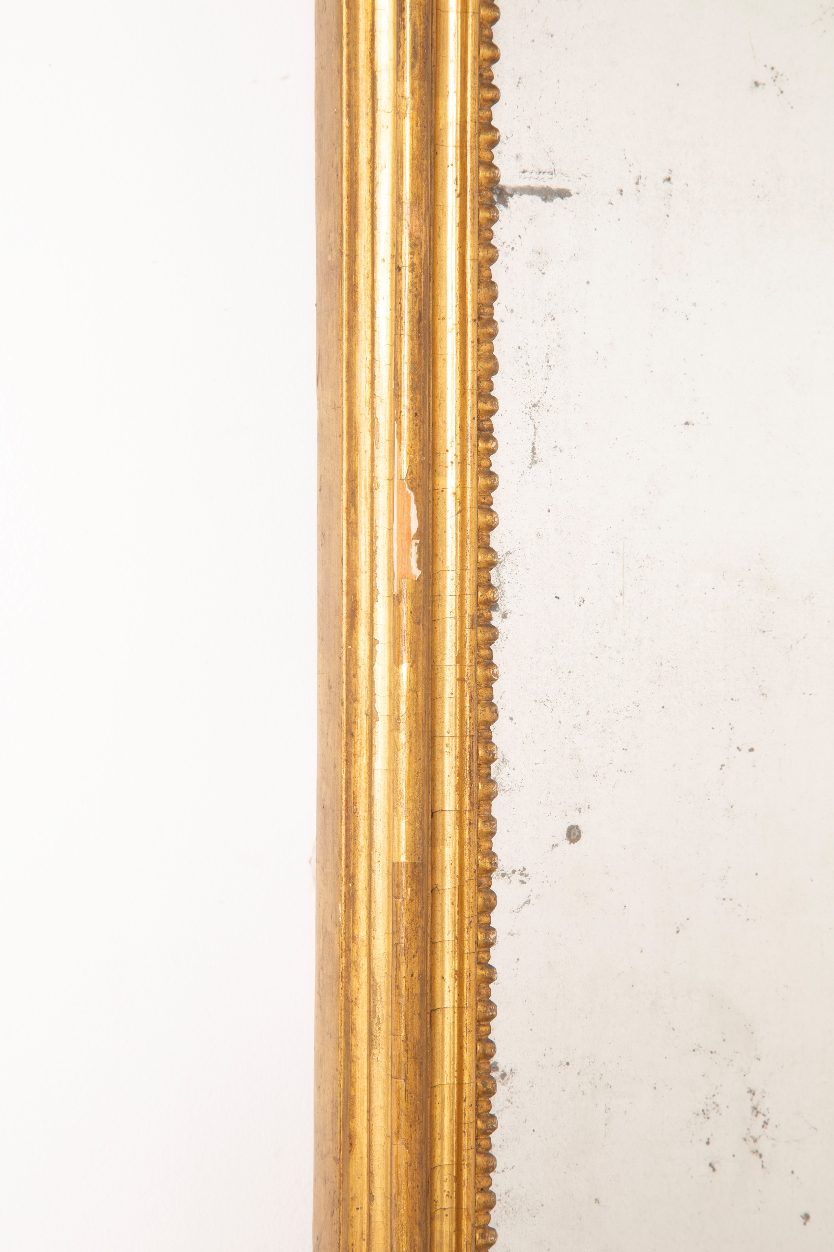 Specchiera in legno dorato con specchio al mercurio, periodo Luigi XVI