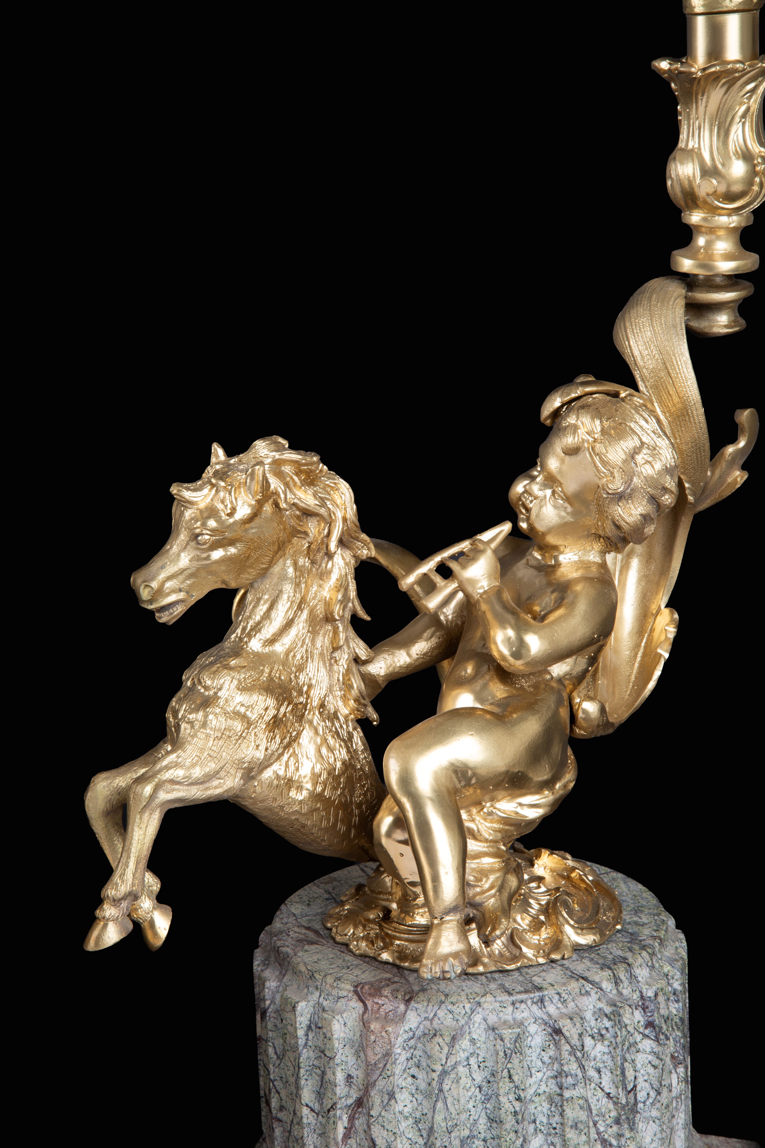 Quattro candelieri, bronzo dorato con putti musicanti e basi in marmo grigio